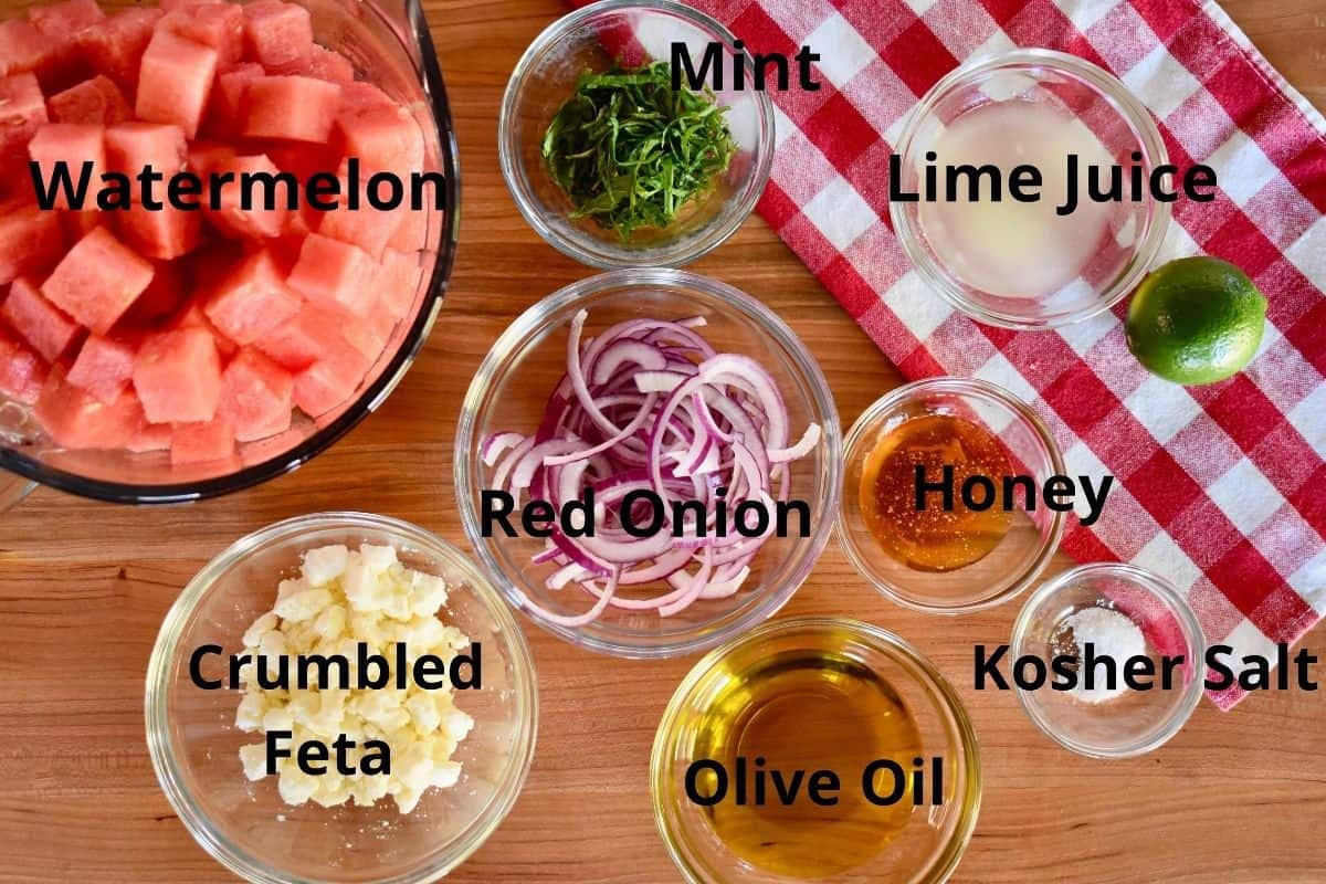 Overhead photo of labeled ingredients on a wood cutting board..