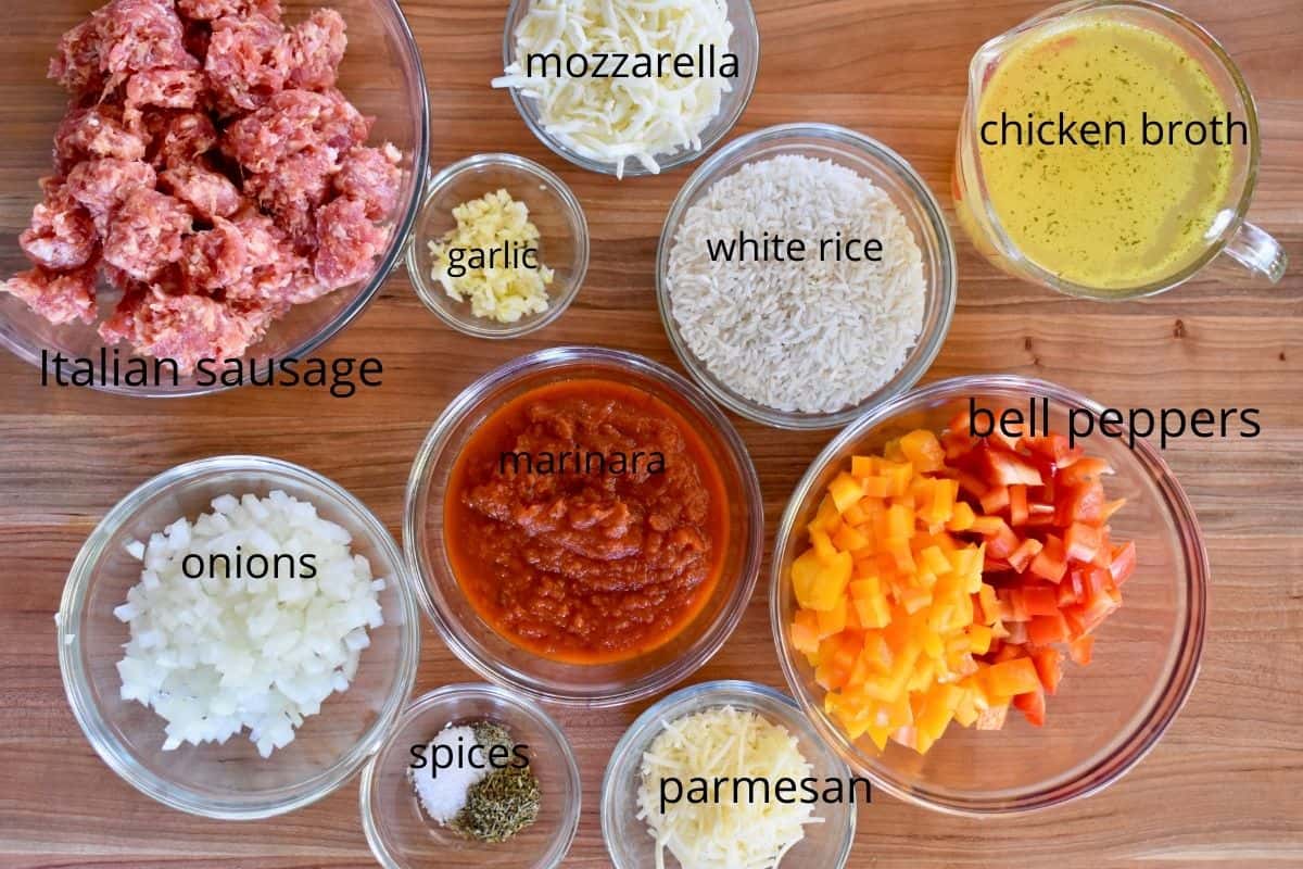 overhead photo of all of the ingredients that go into this recipe including Italian sausage, rice, cheese, and marinara sauce. 