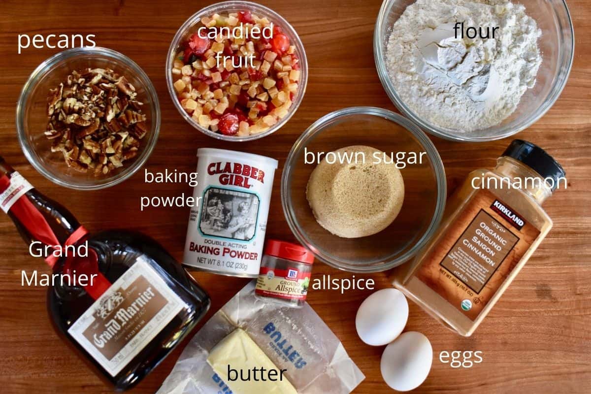 overhead photo of ingredients needed for recipe including candied fruit, butter, Grand Marnier, and spices. 