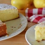 slice of lemon ricotta cake on a white plate.
