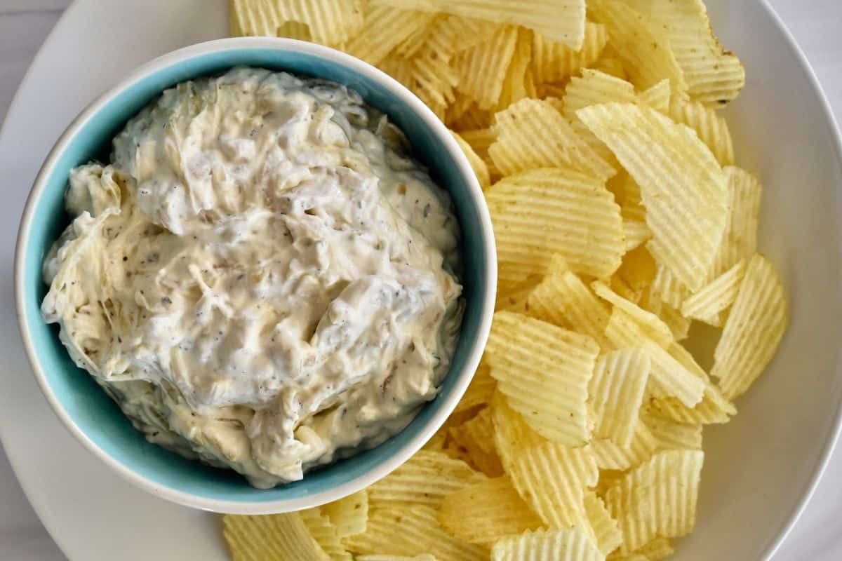 Caramelized Onion Dip overhead photo with potato chips. 