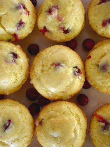 Overhead photo of cranberry orange muffins with a glaze.