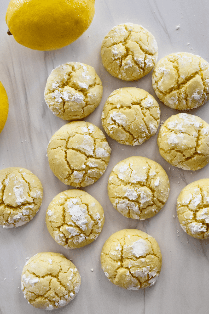 overhead photo of soft lemon cookies on a white countertop. 