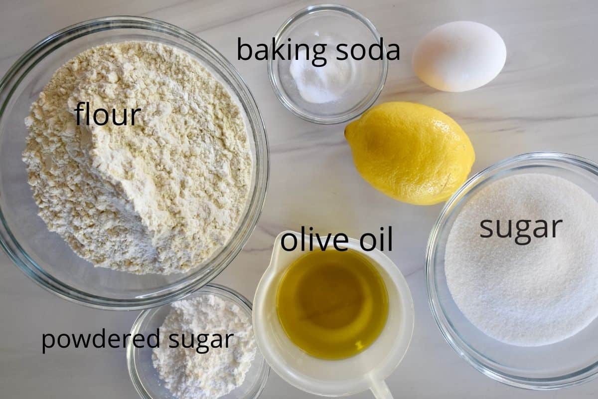 overhead photo of ingredients needed including flour, baking soda, egg, and olive oil. 