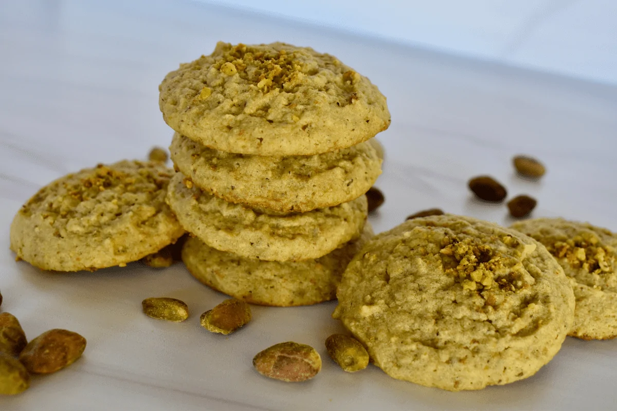 Italian Pistachio Cookies stacked on each other. 