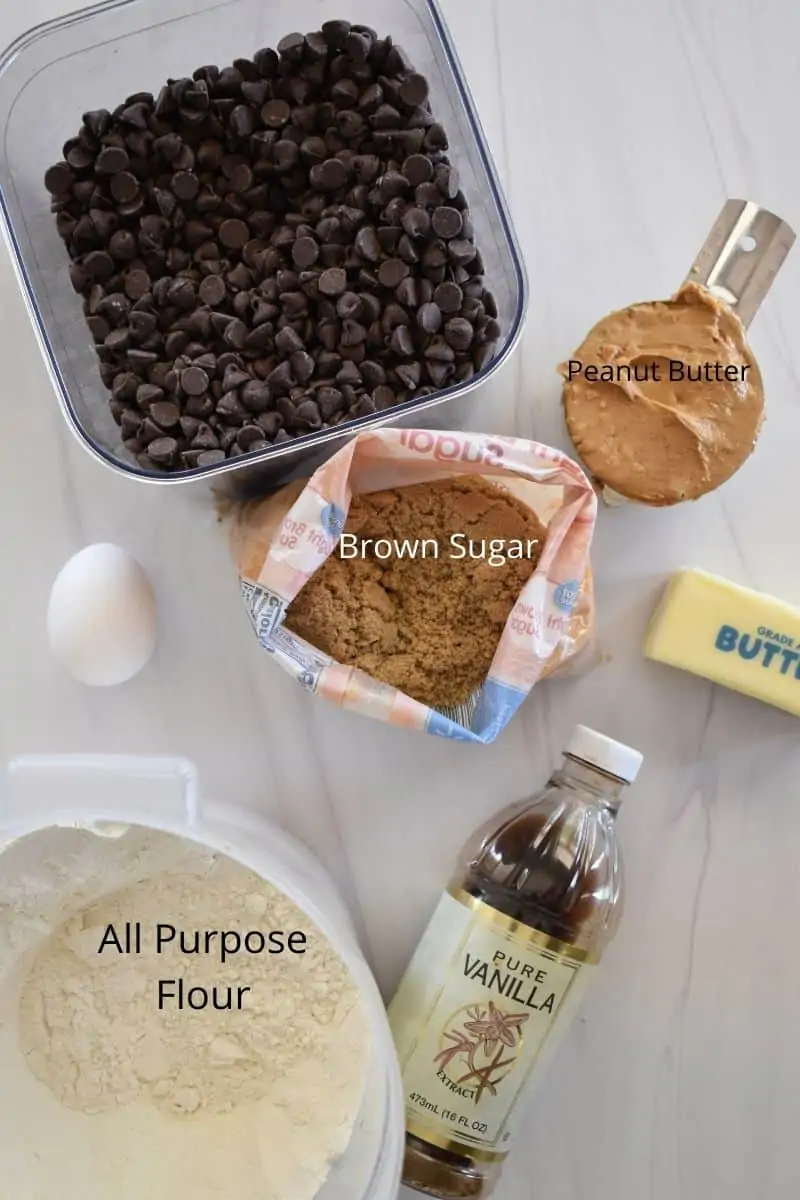 overhead photo showing ingredients for recipe including brown sugar, flour, butter, egg, and chocolate chips. 
