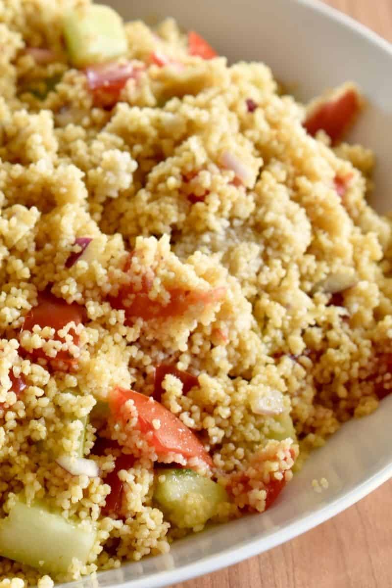 curried couscous in a white bowl. 