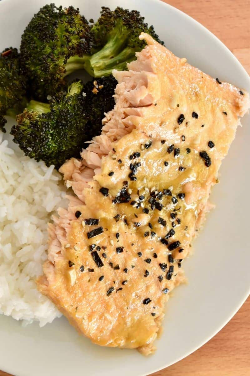 Asian Salmon Marinade on a plate with broccoli and rice. 