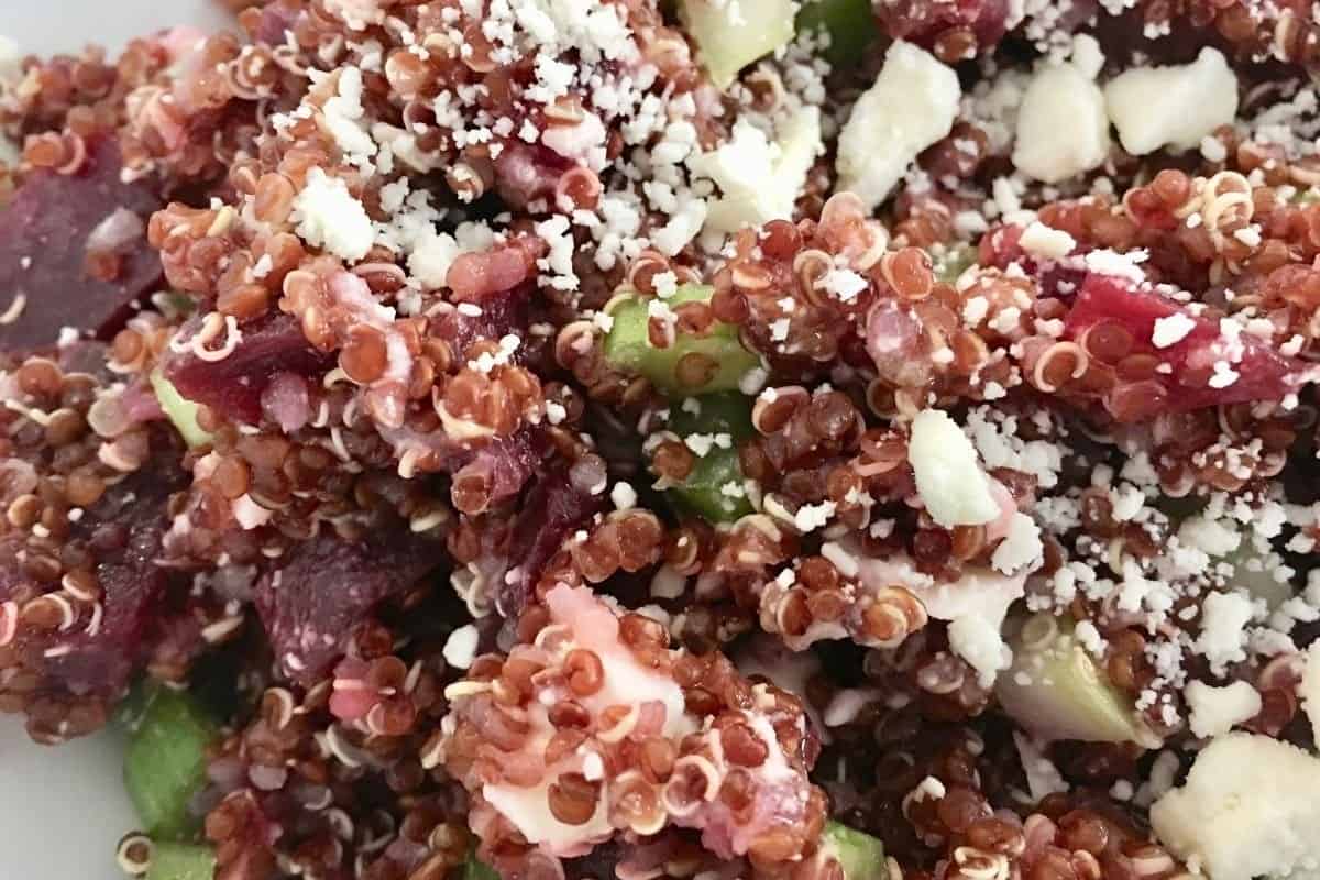 close up of quinoa beet salad with celery and feta cheese. 