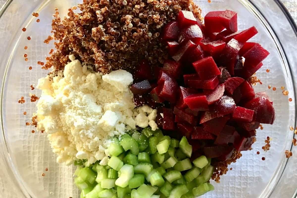 overhead photo of the recipe ingredients in a bowl, including feta and celery.