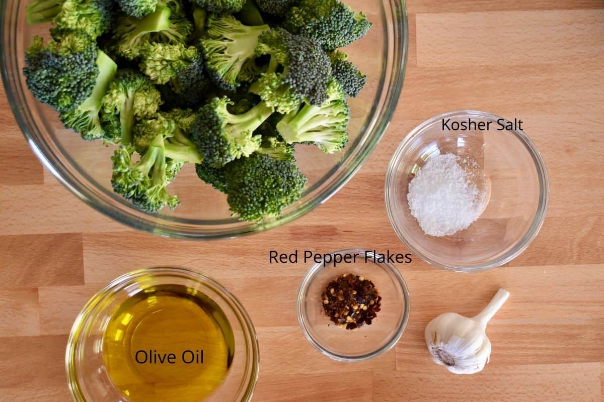 overhead photo of ingredients for recipe including salt, olive oil, and red pepper flakes. 