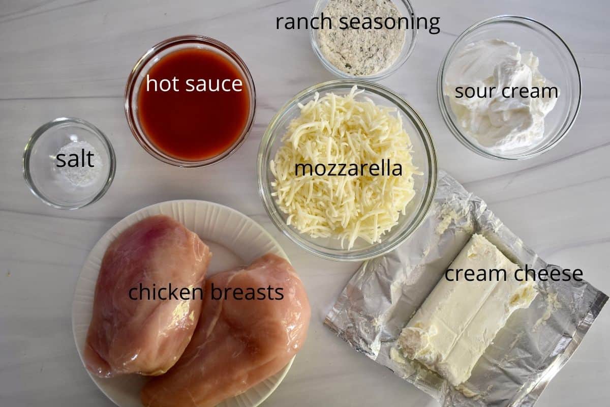 overhead photo of recipe ingredients including cream cheese and frank's red hot sauce. 