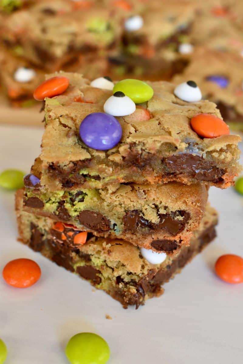 Halloween Cookie Bars with Ghouls M&M's on a countertop stacked on each other.  