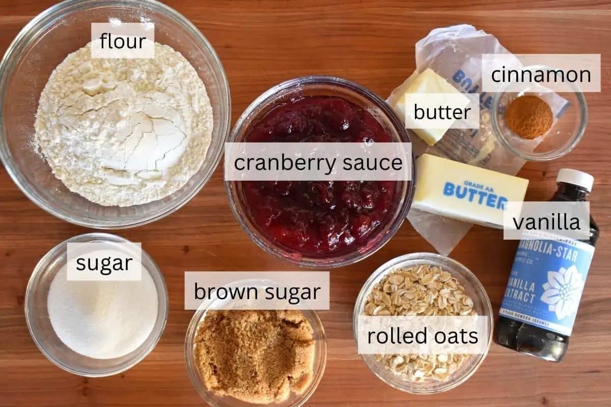 overhead photo of ingredients for recipe including butter, flour, sugar, vanilla, and cinnamon. 