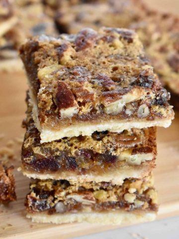 Pecan Pie Date Bars stacked on each other.