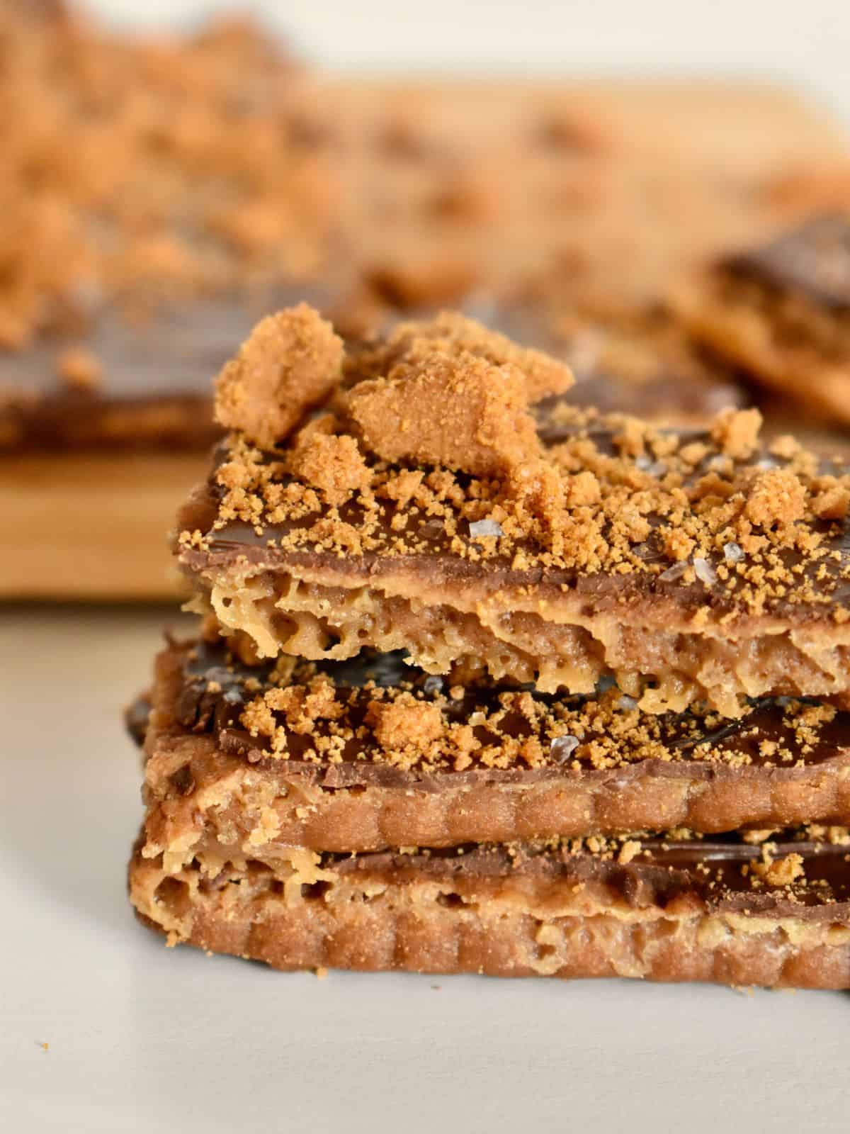 Biscoff Toffee stacked on each other on a white countertop. 