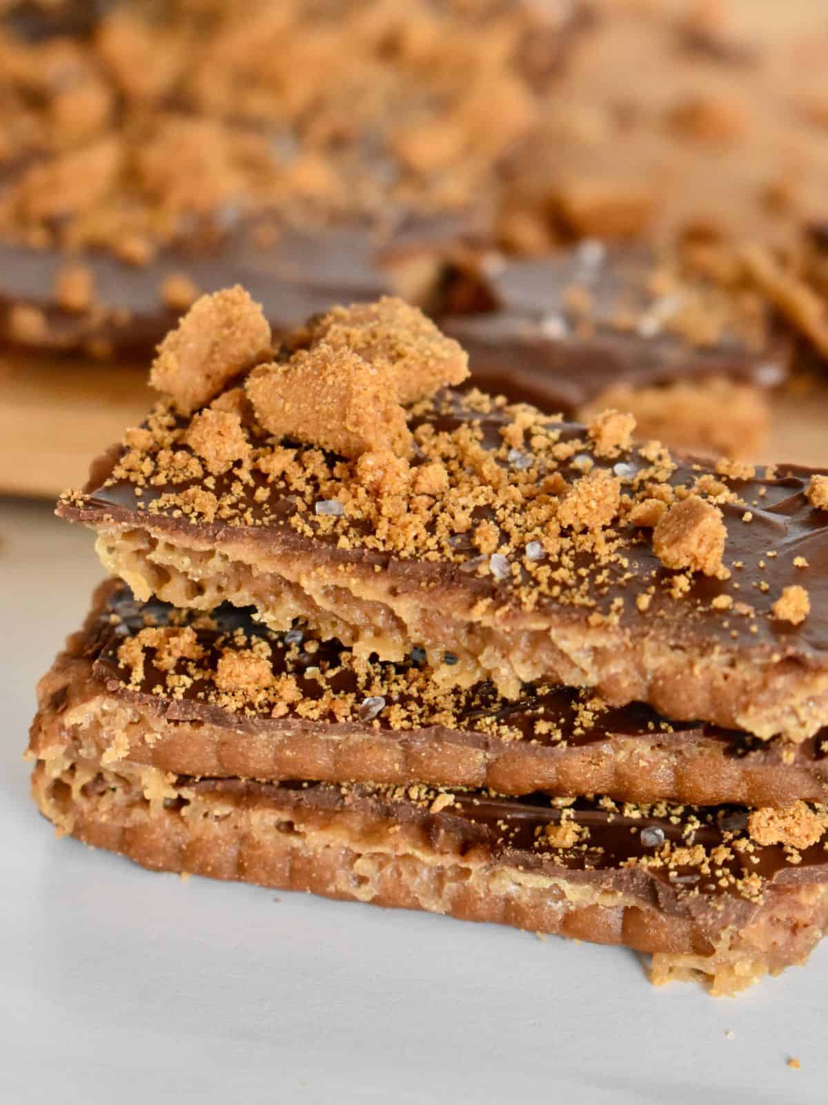 Biscoff Toffee stacked on each other on a white countertop. 