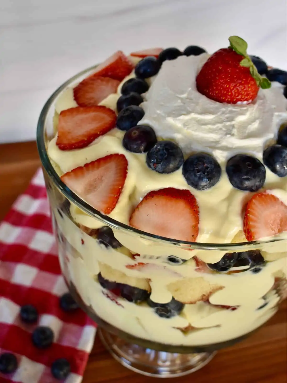 Overhead photo of pound cake trifle with berries arranged on top.