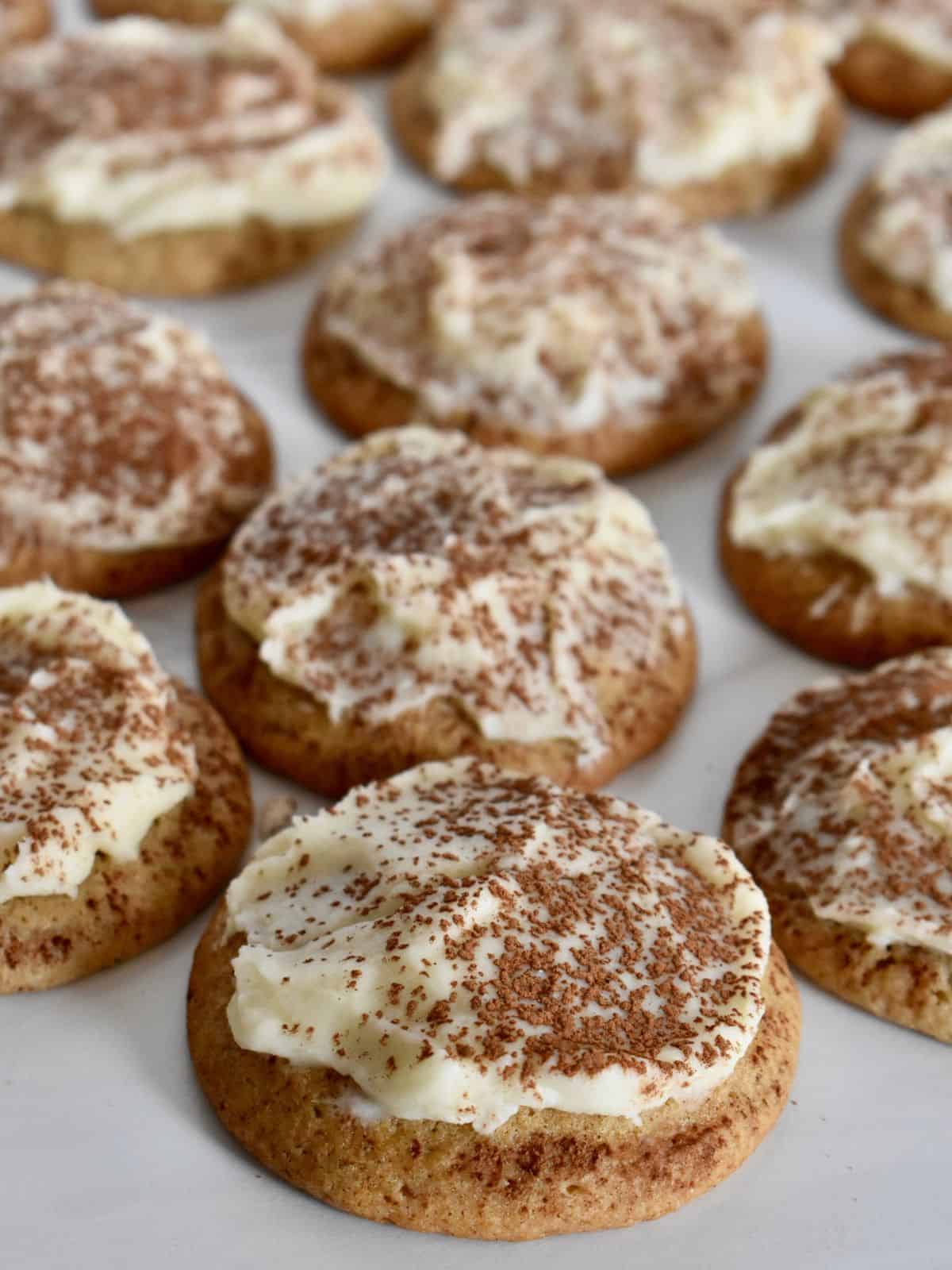 Tiramisu Cookies with mascarpone frosting on a white countertop. 