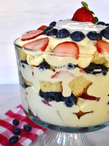 Pound Cake Trifle in a glass trifle bowl with vanilla pudding and berries.