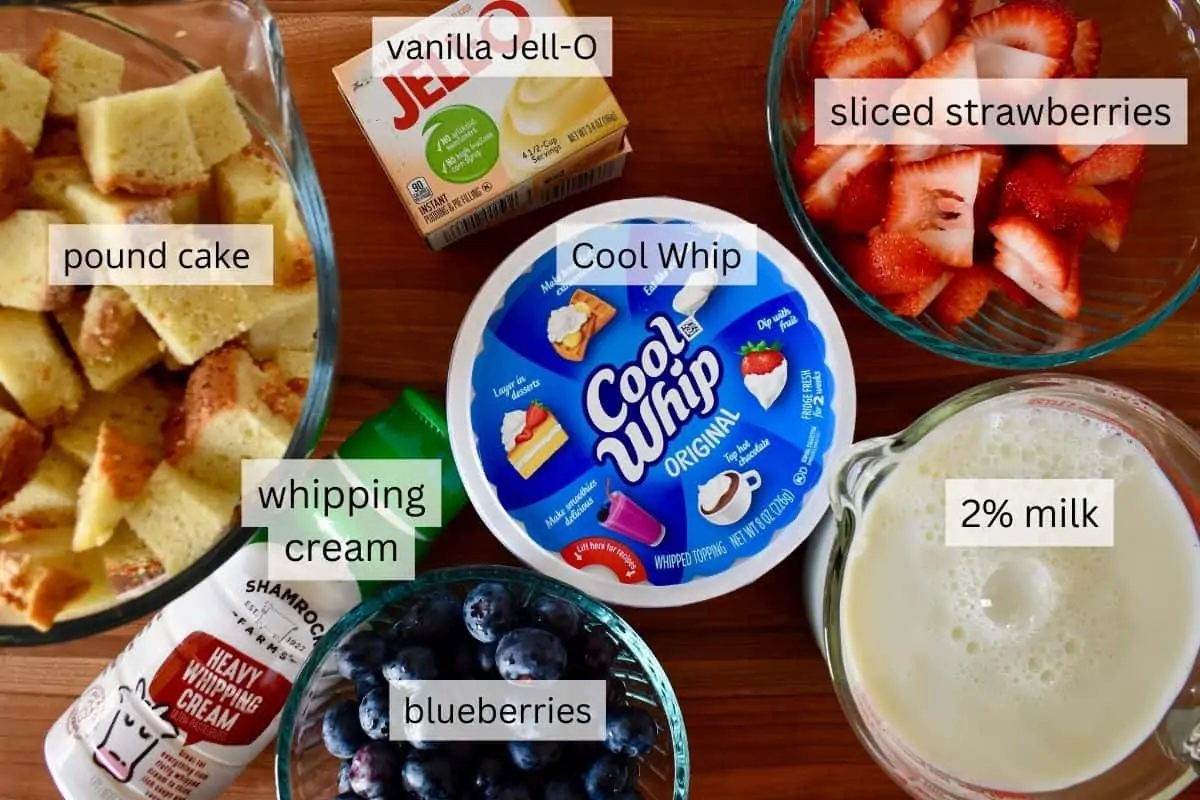 overhead photo of ingredients including cool whip, vanilla pudding mix, and berries. 