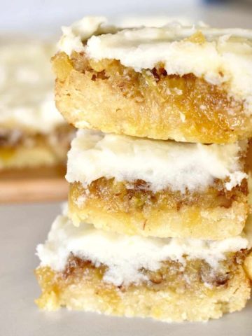 Pineapple Bars stacked on each other on a countertop.