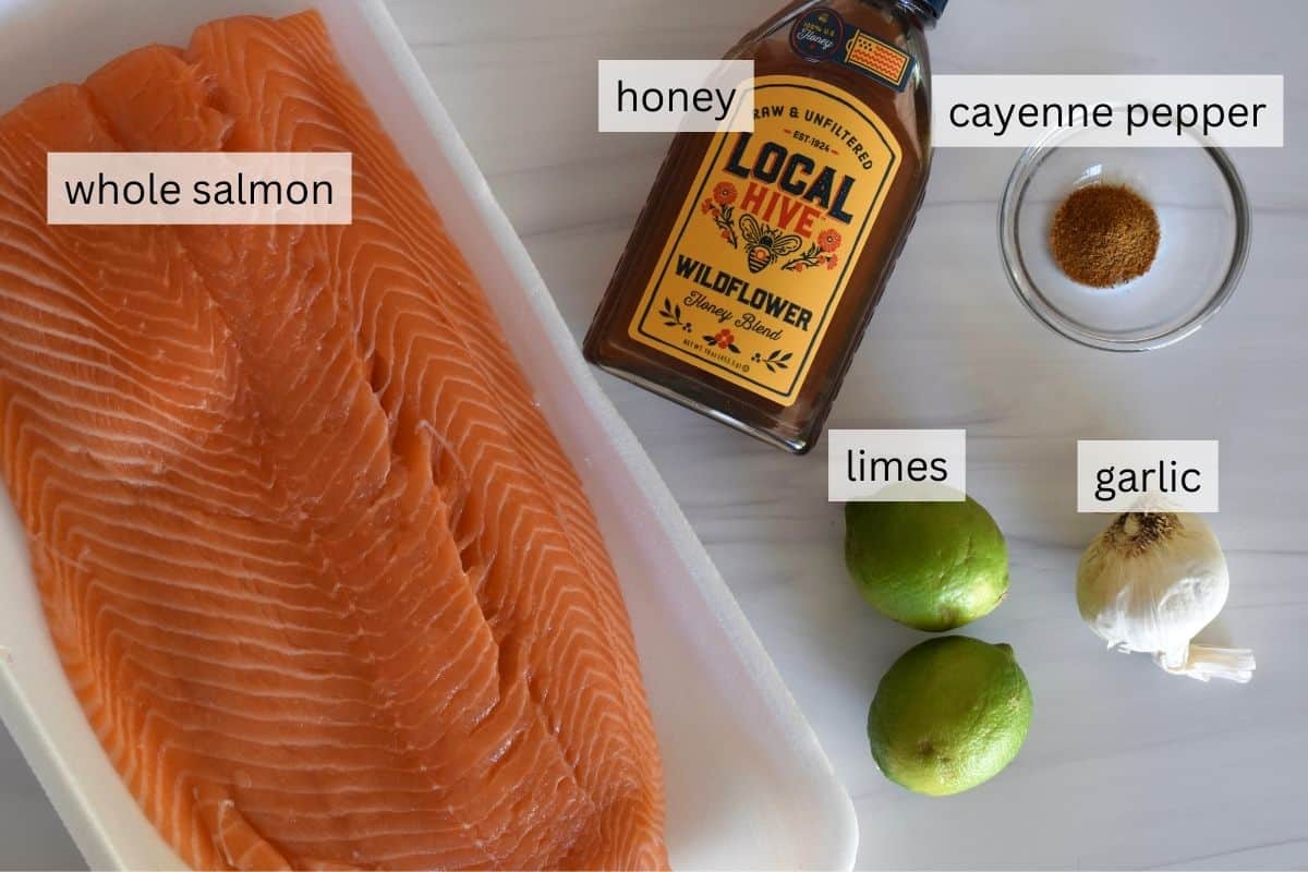 ingredients needed to make recipe including garlic, cayenne pepper, and fish. 