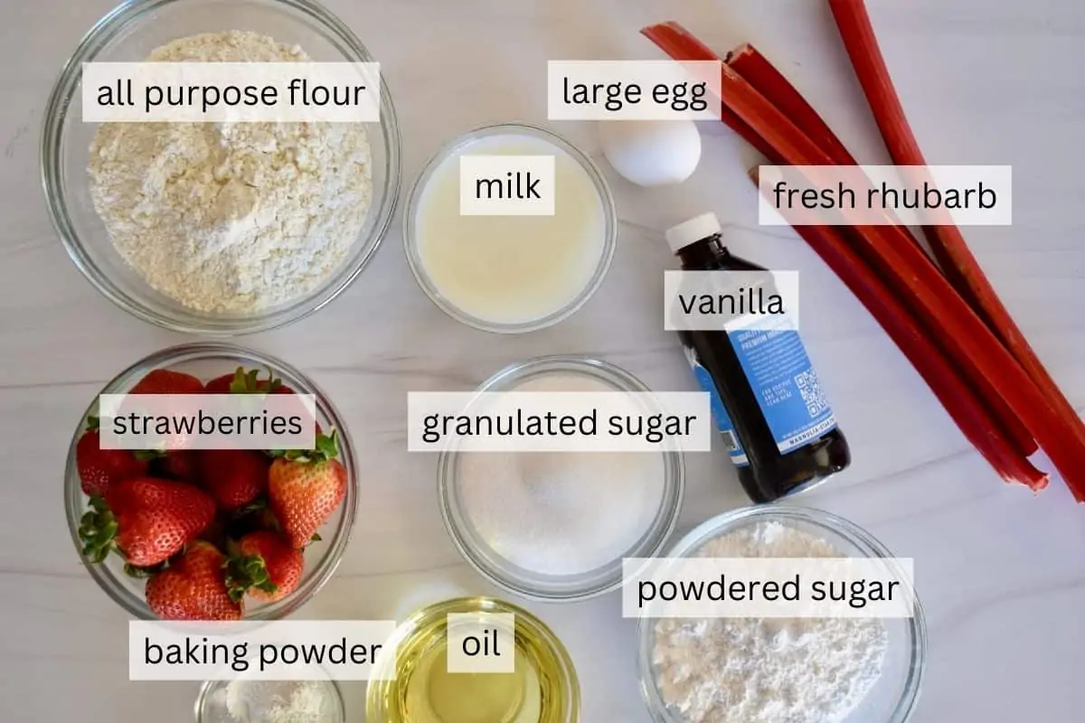 overhead photo of ingredients needed for recipe including flour, sugar, vanilla, eggs, and oil. 