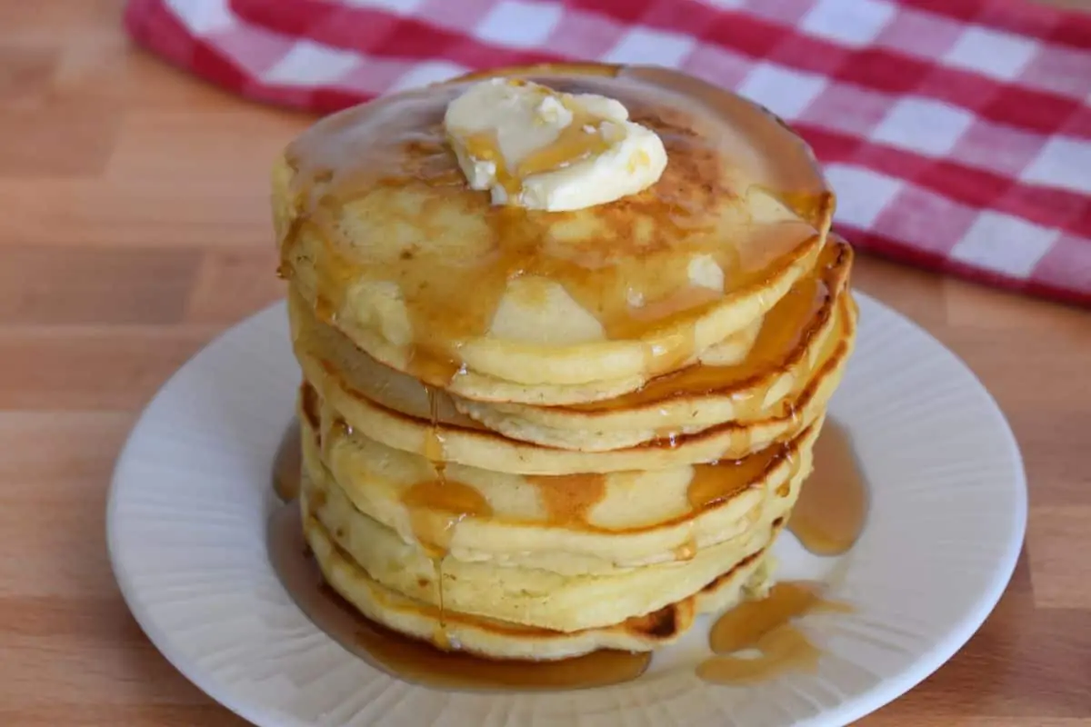 stack of pancakes on a white plate made using homemade pancake mix from scratch. 