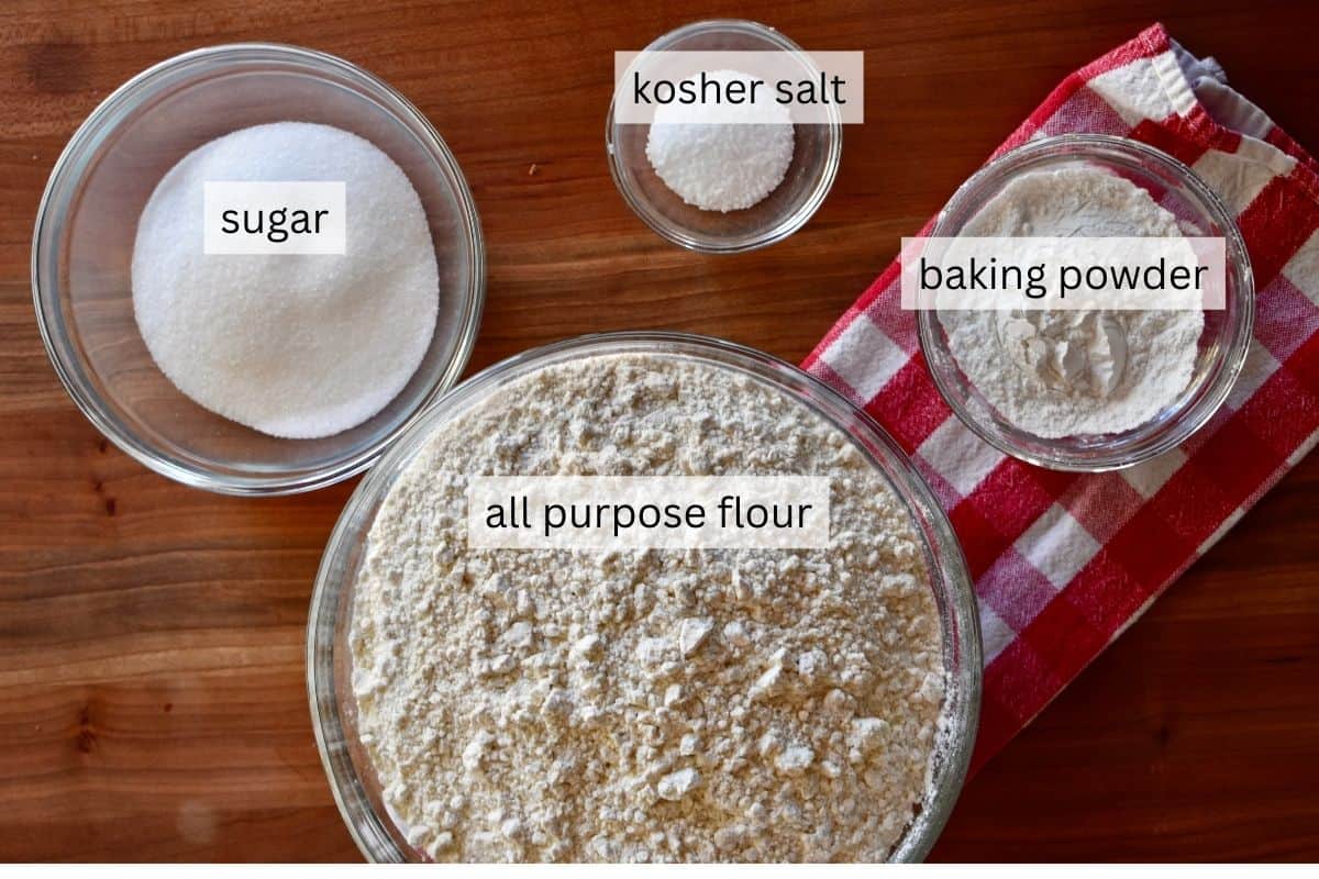 overhead photo of ingredients including flour, baking powder, sugar, and kosher salt. 