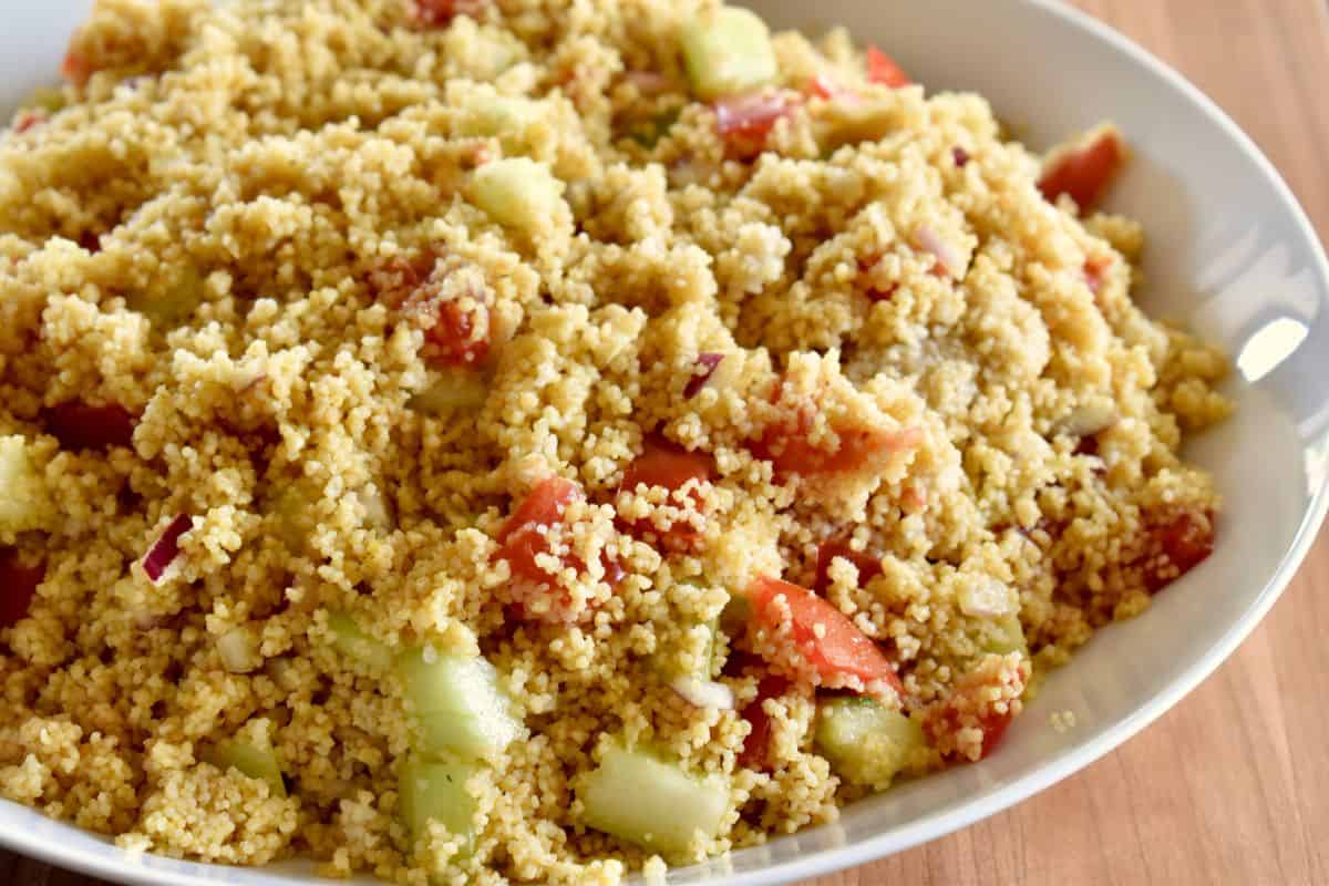 Curried Couscous in a white bowl. 