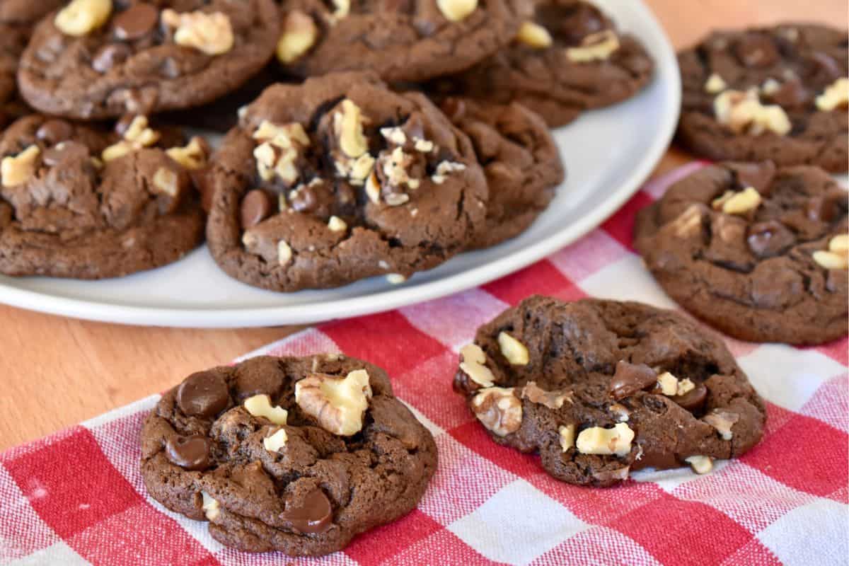 Chocolate Walnut Cookies on a checkered napkin. 