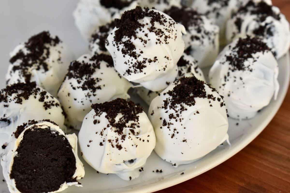 Cookies and cream truffles on a white plate. 