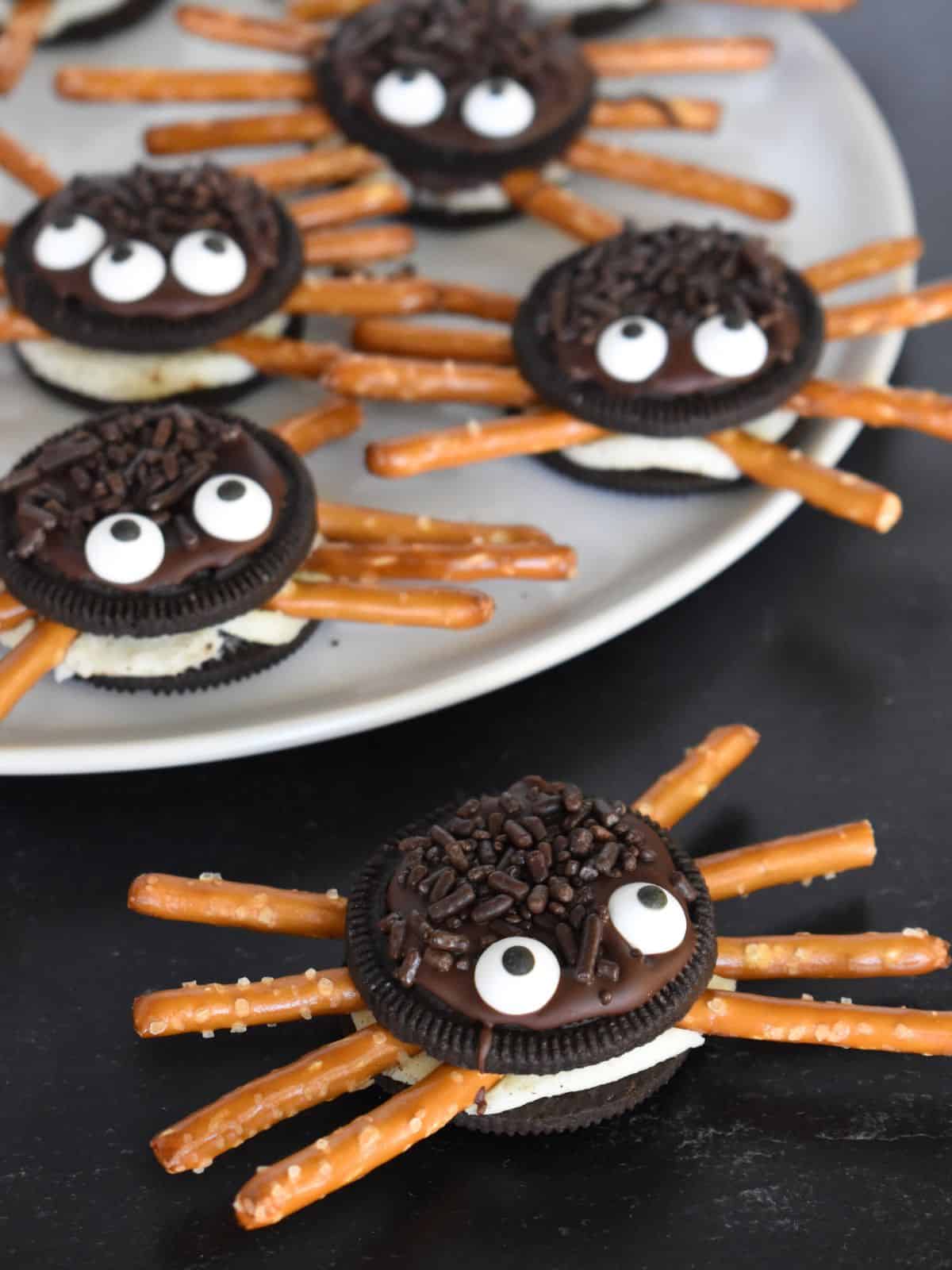 Oreo Cookie Spiders are the perfect halloween treat with pretzel rod legs. 