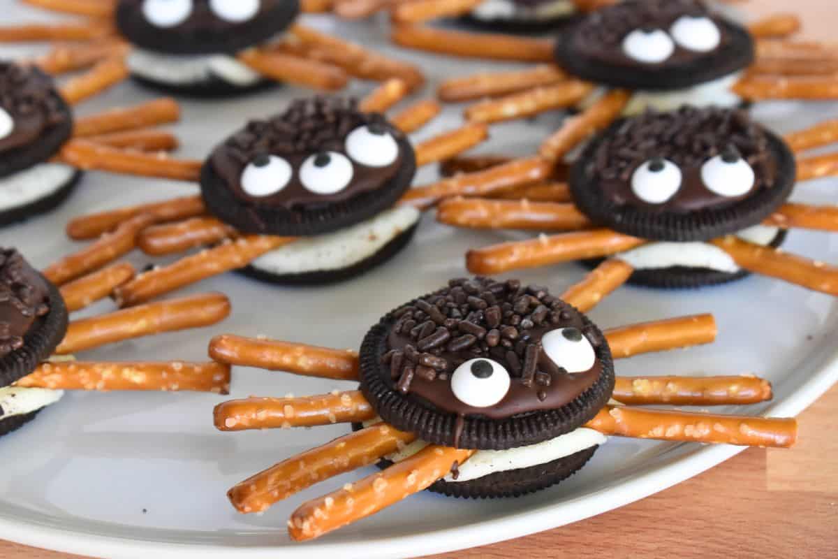 Oreo Cookie Spiders on a white plate. 