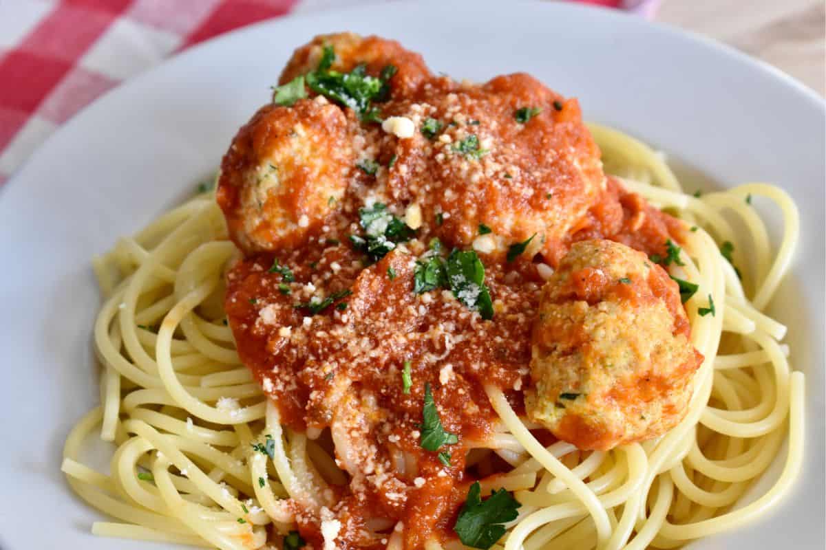 Turkey Ricotta Meatballs on a plate of spaghetti. 