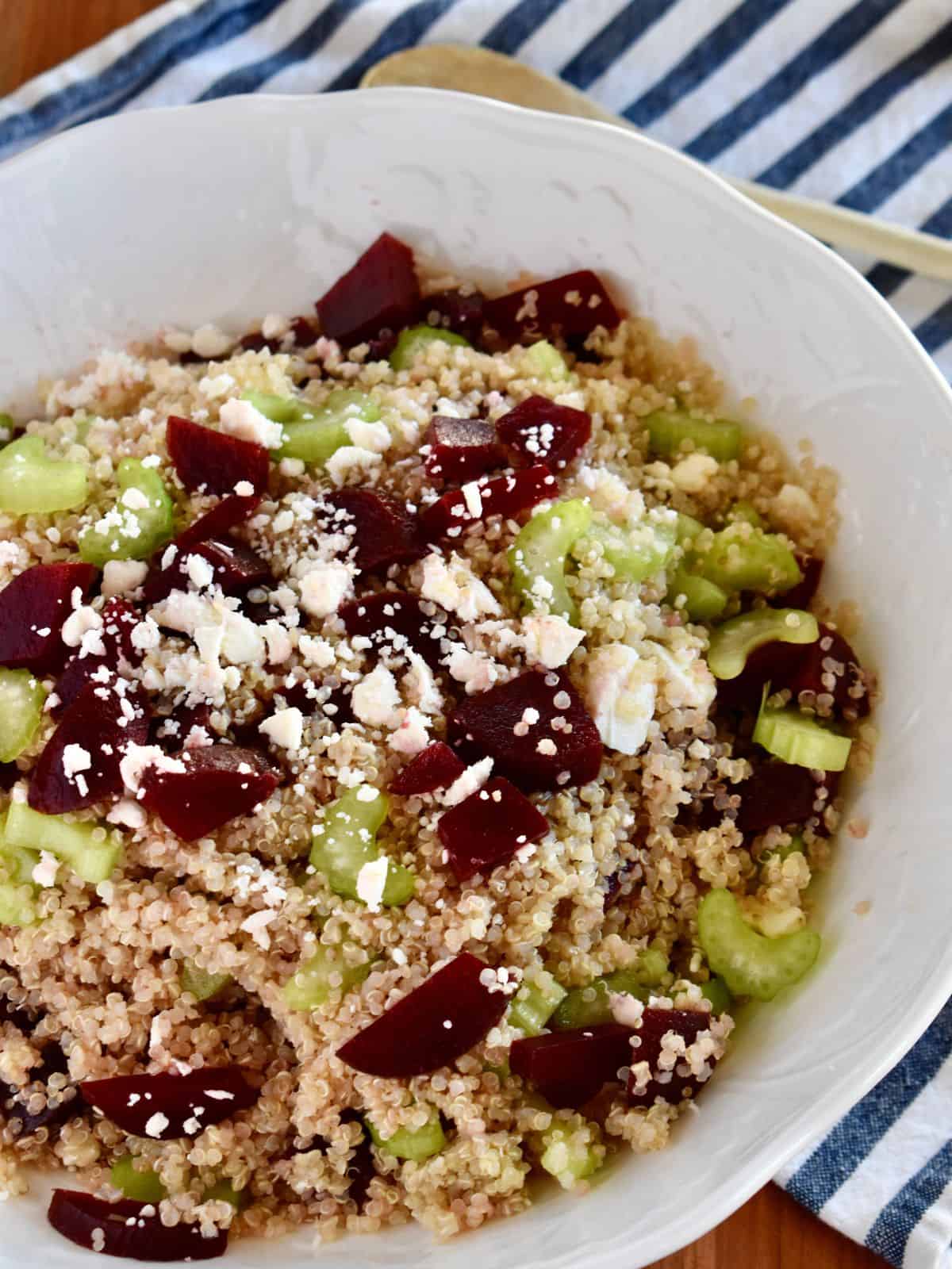 Quinoa Beet Salad with feta cheese crumbles in a large white bowl. 