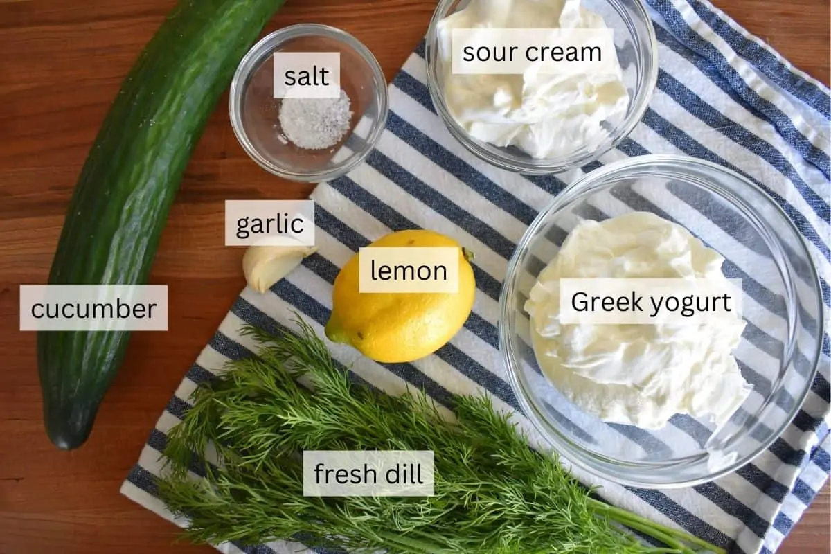 Ingredients for recipe including dill, yogurt, lemon, cucumber, and garlic. 