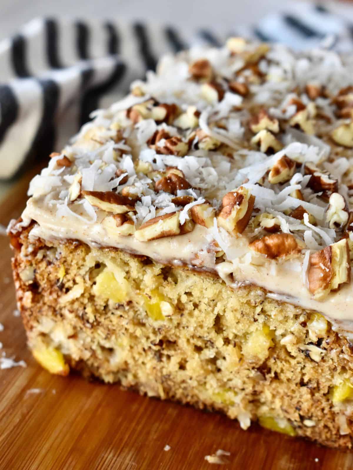 Hummingbird Bread with Cream Cheese frosting made with pineapple, pecans, bananas, and coconut.