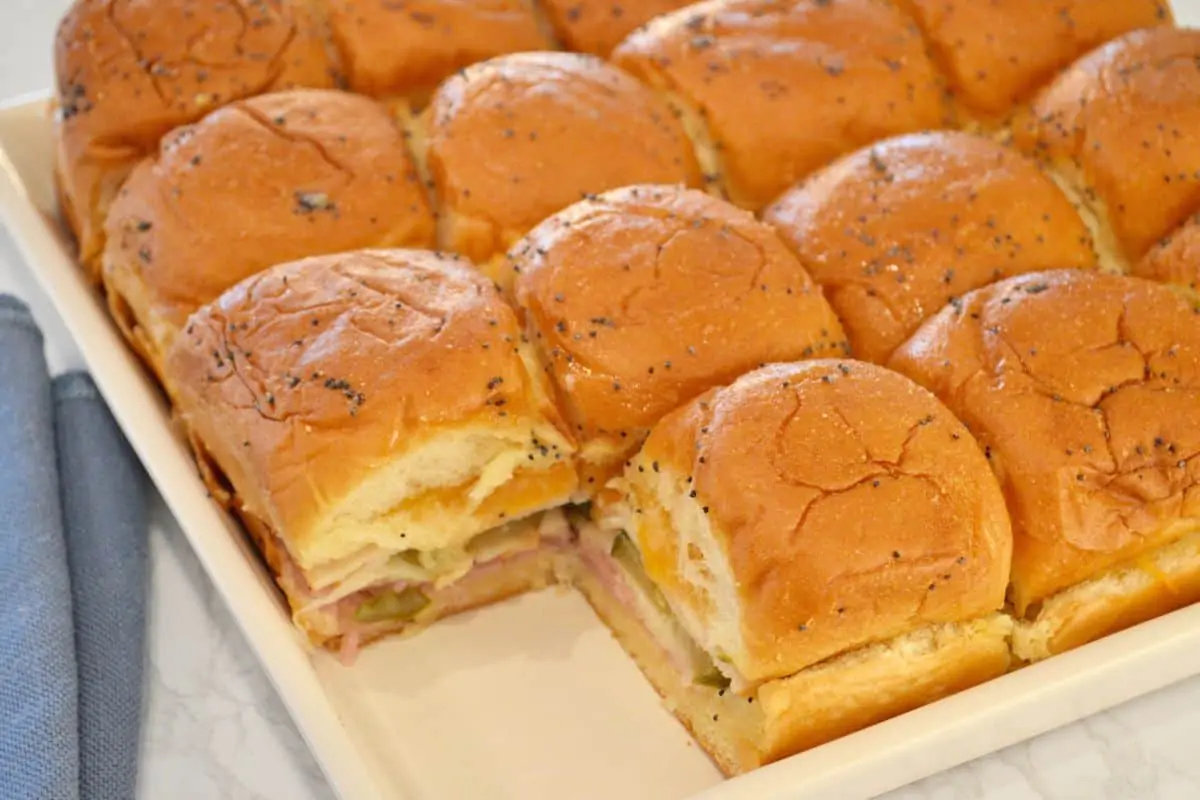 Baked Sliders on a King's Hawaiian Rolls on a white plate. 