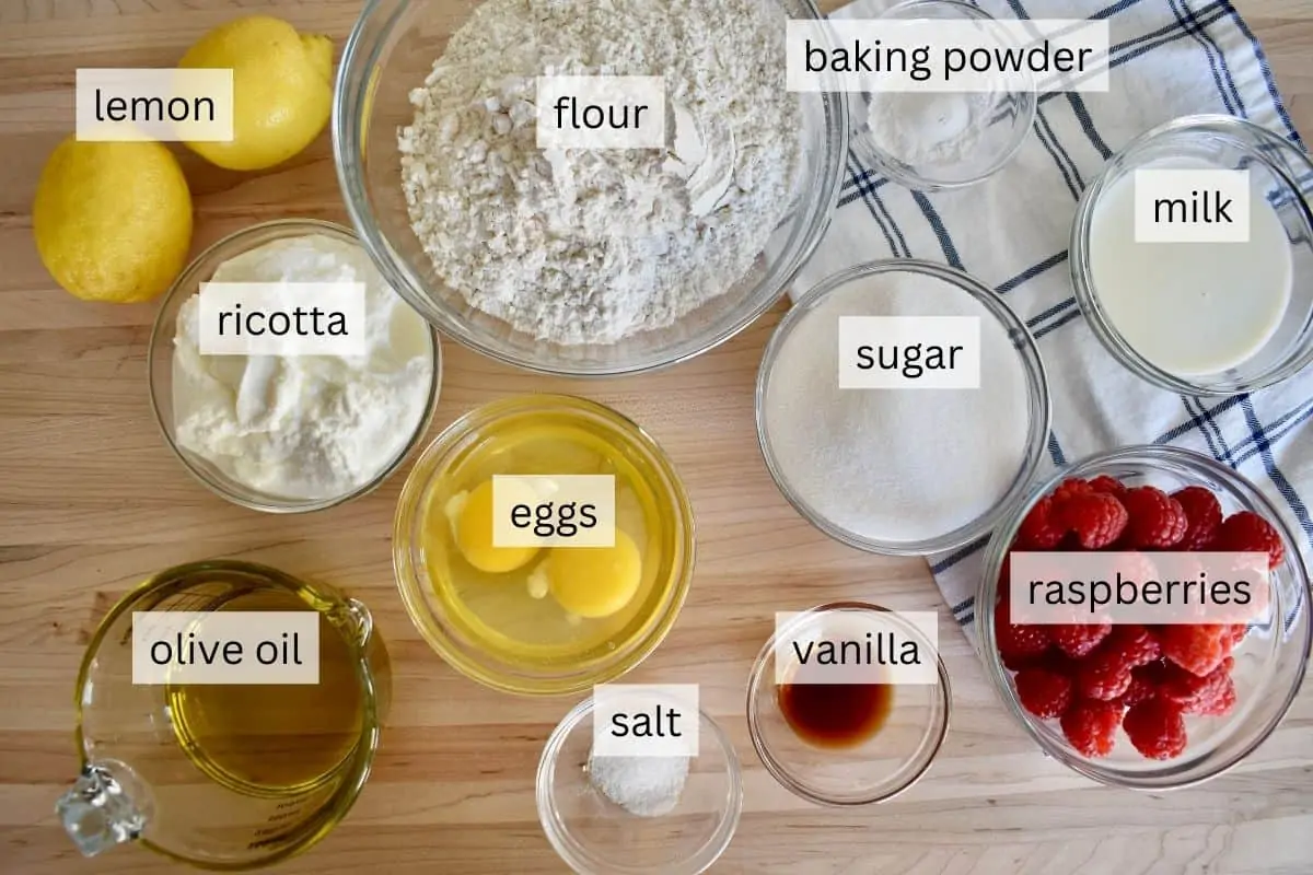 Ingredients including flour, eggs, ricotta, olive oil, and sugar. 