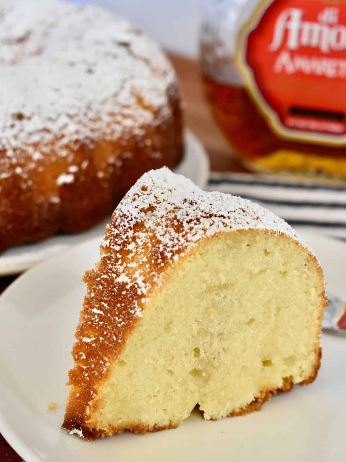 Amaretto Pound Cake with Amaretto Butter glaze on a white plate. 