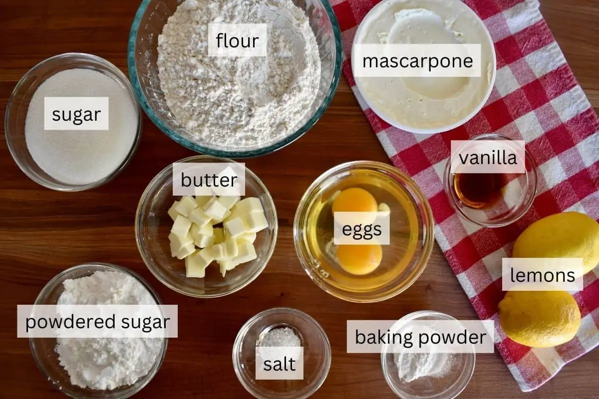 Ingredients for recipe including eggs, butter, flour, and powdered sugar.