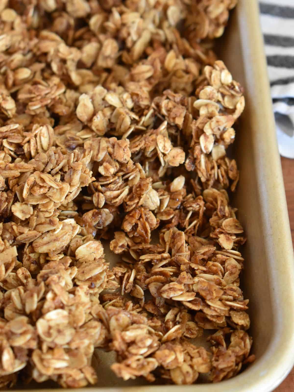 Granola recipe without nuts on a large rimmed baking sheet. 