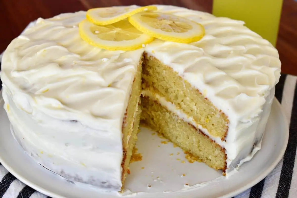 Limoncello Ricotta Cake with a slice removed from it. 