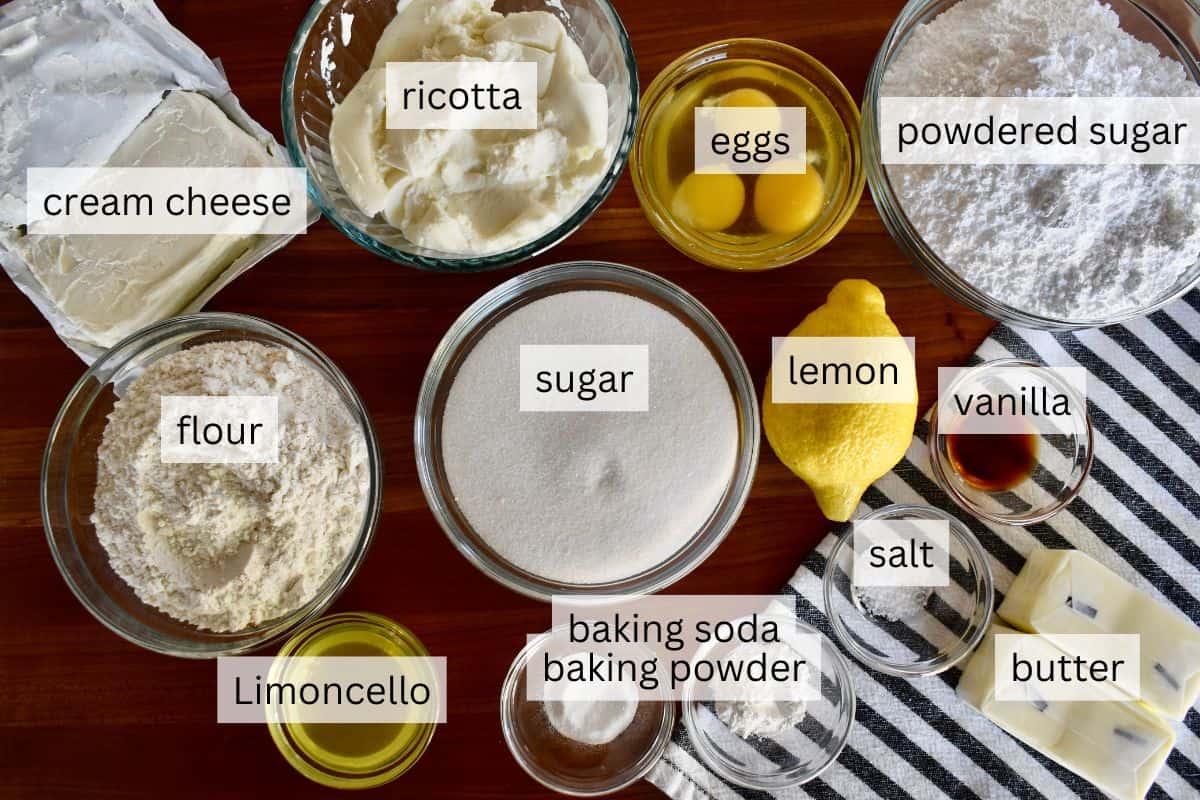 Ingredients for recipe including lemon, sugar, flour, butter, and eggs. 