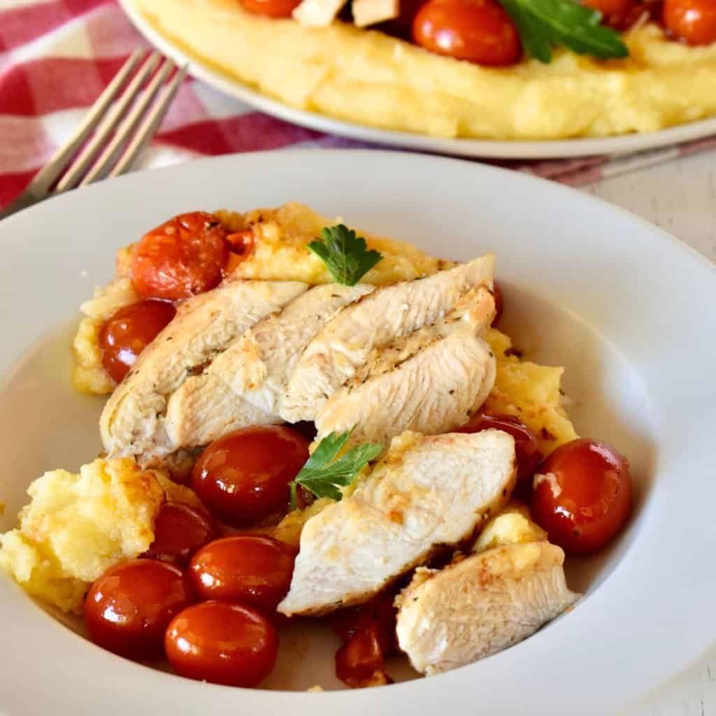 Chicken with Polenta and cherry tomatoes.