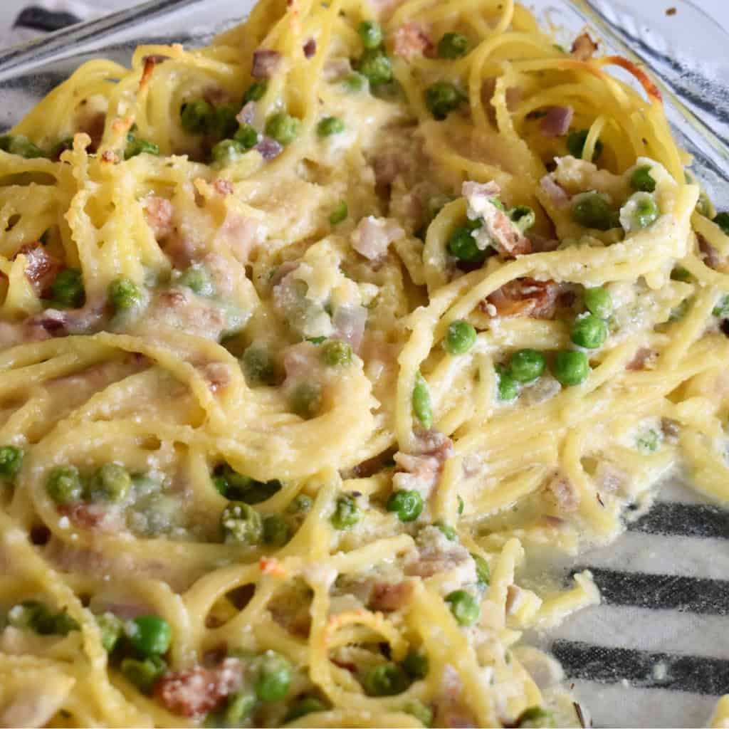 Baked Spaghetti with Ricotta, bacon and peas.