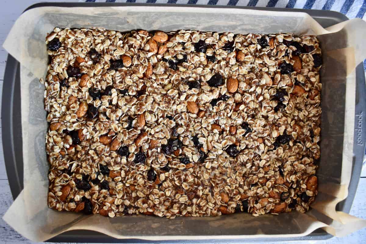 Mixture pressed into the bottom of a 9 x 13 inch baking pan covered with parchment paper.