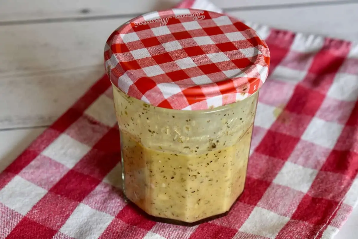 Dressing in a small glass jar.